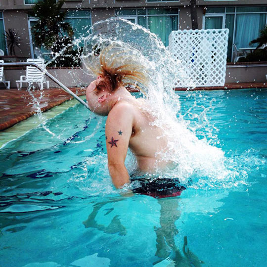 funny-bearded-man-pool-water-hair.jpg