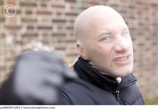 1313461281_threatening_mugger_with_stocking_mask_pe0065911.jpg