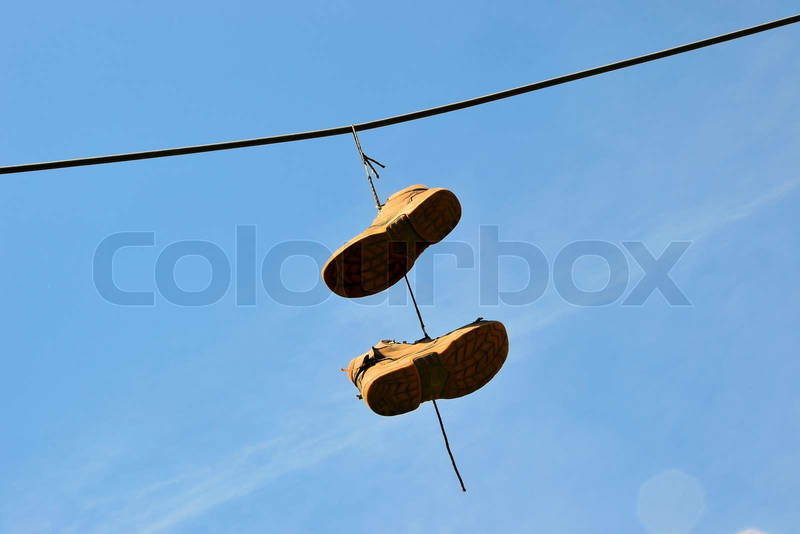 7062220-662099-old-shoes-hanging-on-a-power-line-in-a-city.jpg
