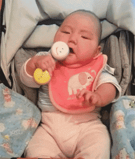 Baby-Hits-Itself-in-Face-With-Toy.gif